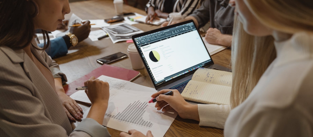 Group of people discussing an issue on paper