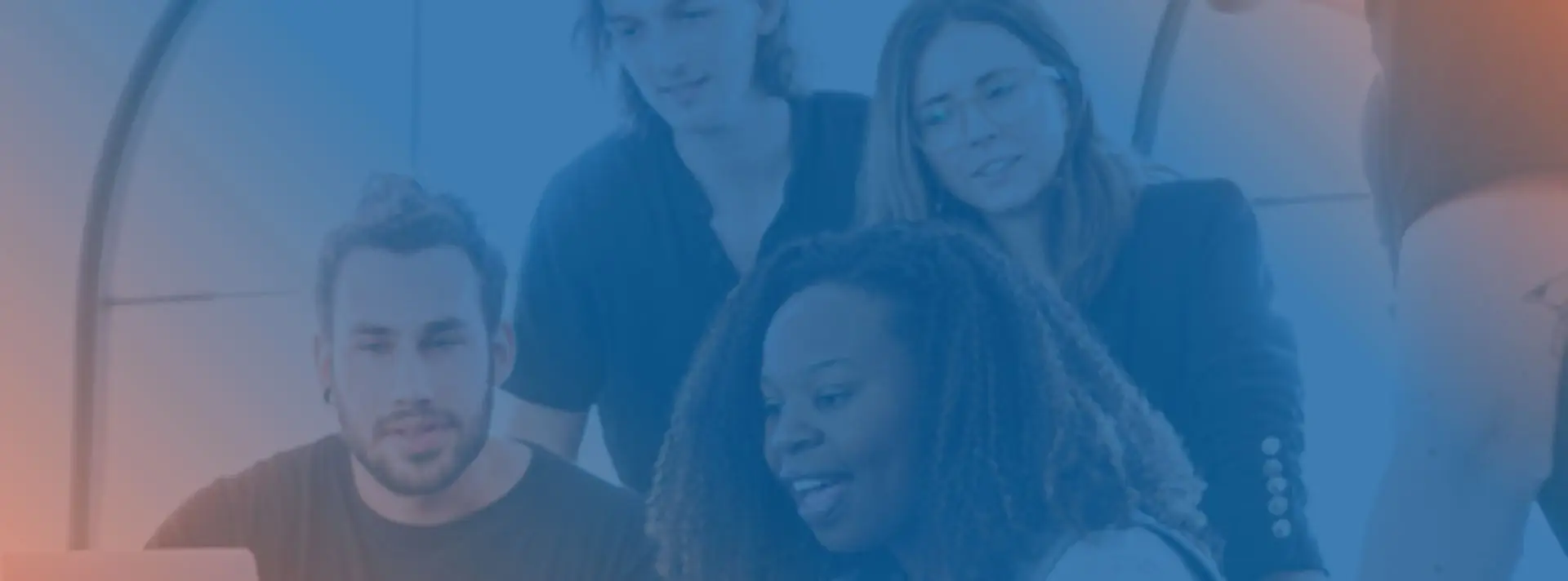 people looking at a laptop