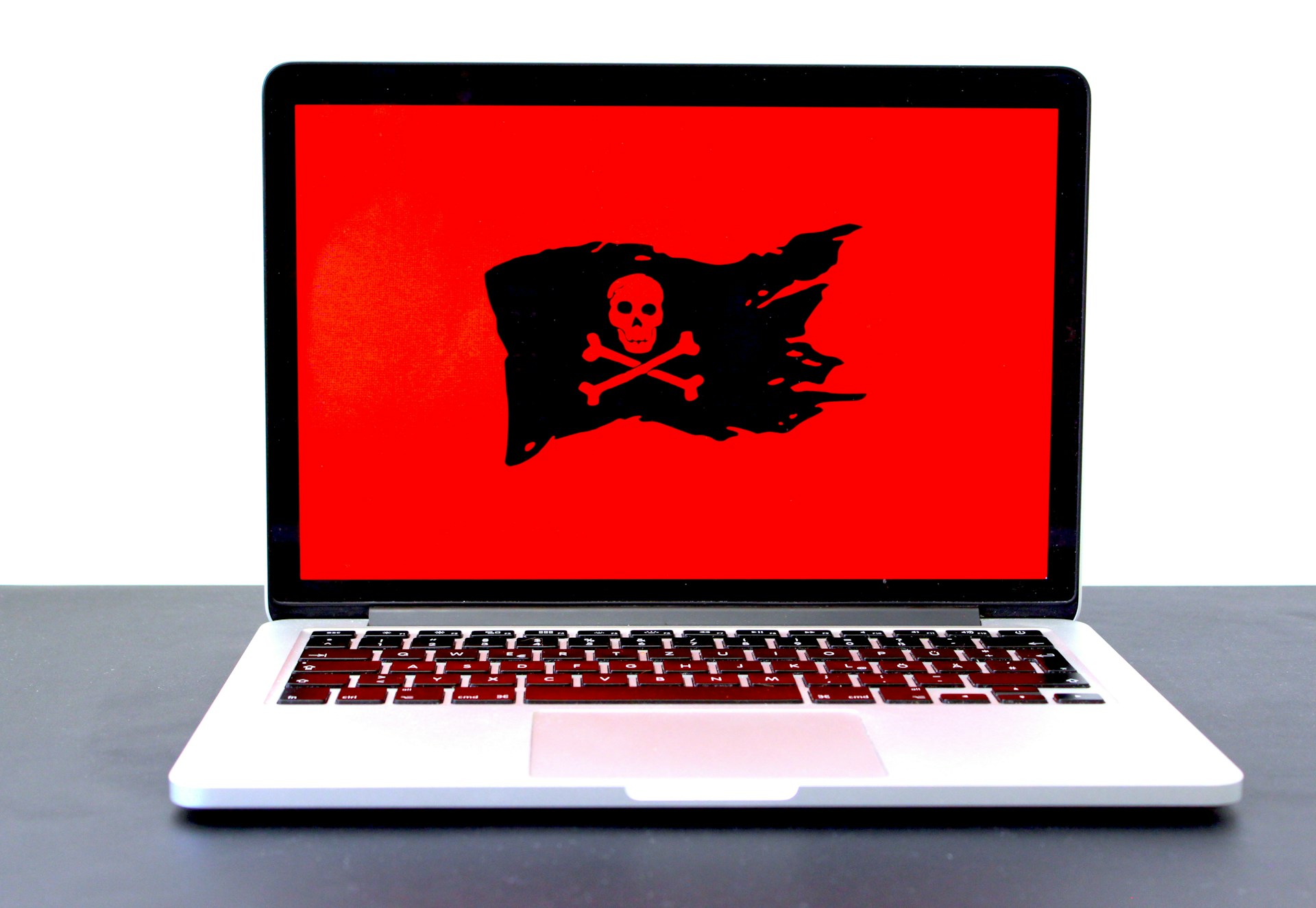 laptop with red danger sign
