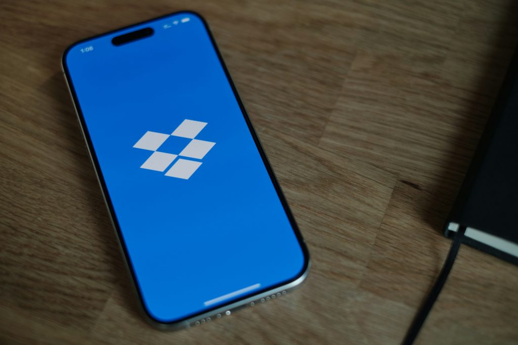 Dropbox logo on a blue screen on a phone screen
