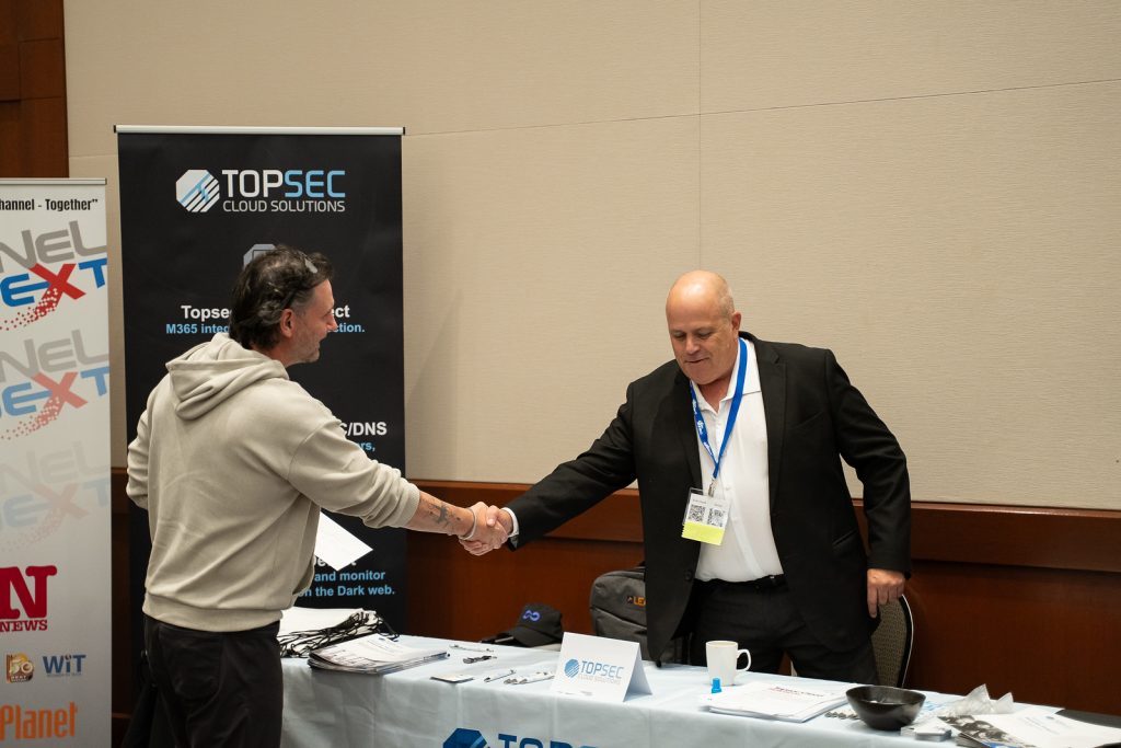 Steven shaking hands with a vendor